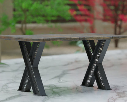 criss cross table legs with geometric pattern