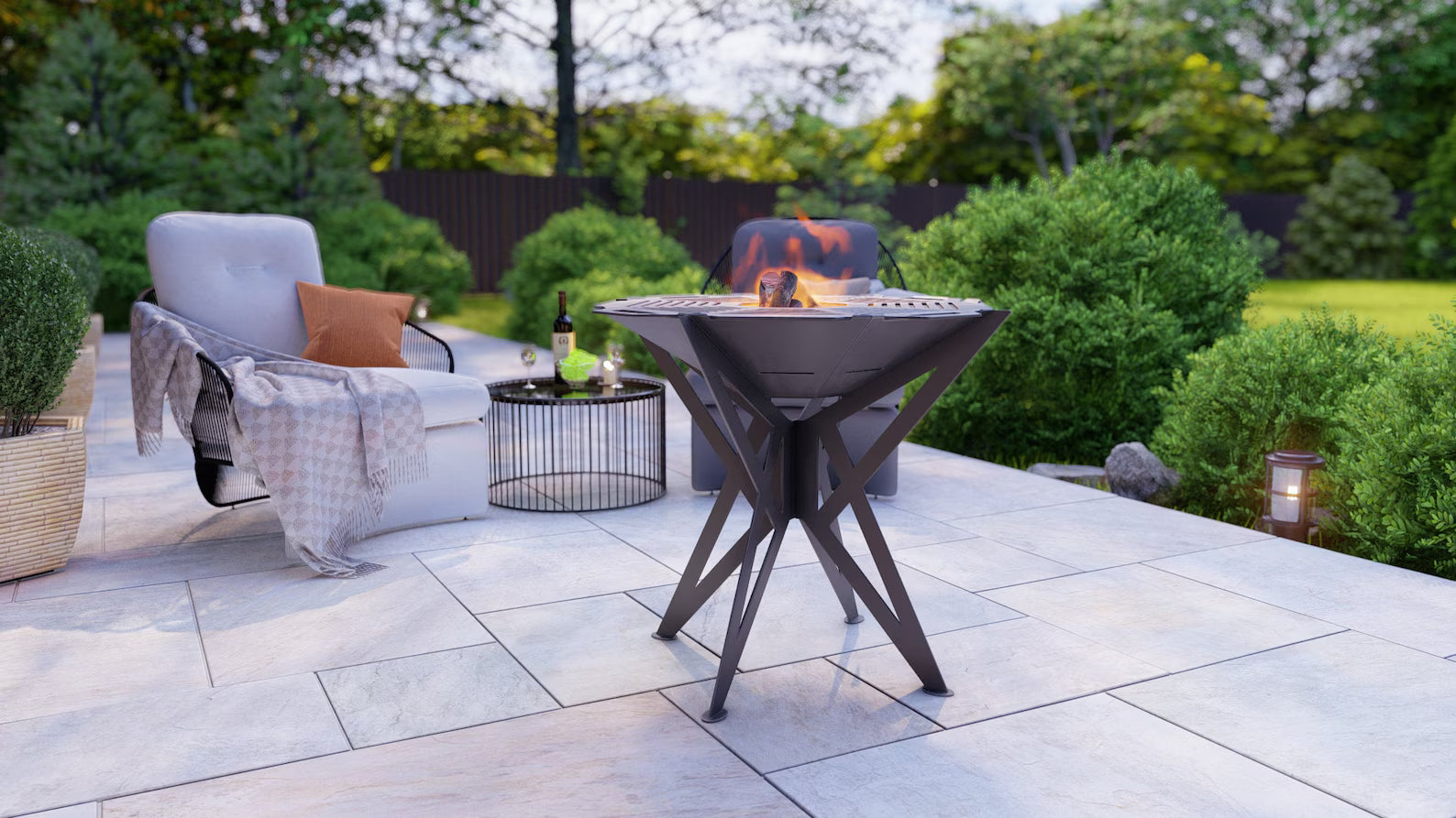 Outdoor patio with fire pit, chairs, and table in a garden setting
